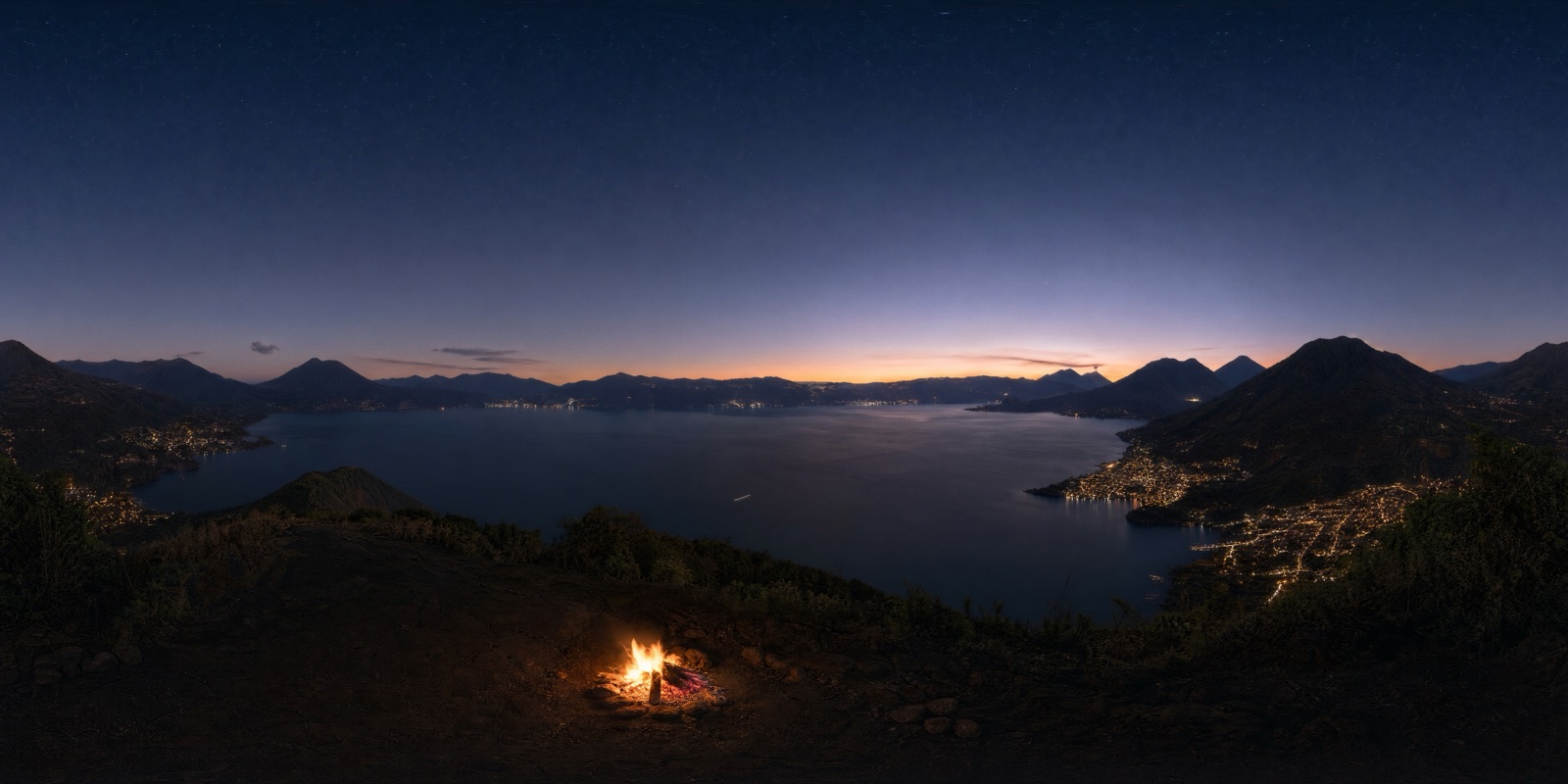 An immersive 360° world — a volcanic lake at night, by a campfire